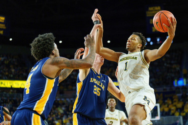 No. 2 Michigan closing gap on No. 1 Arizona